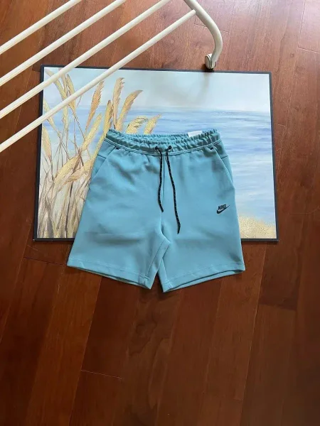 Light blue drawstring shorts shown in the linked Nike catalog listing