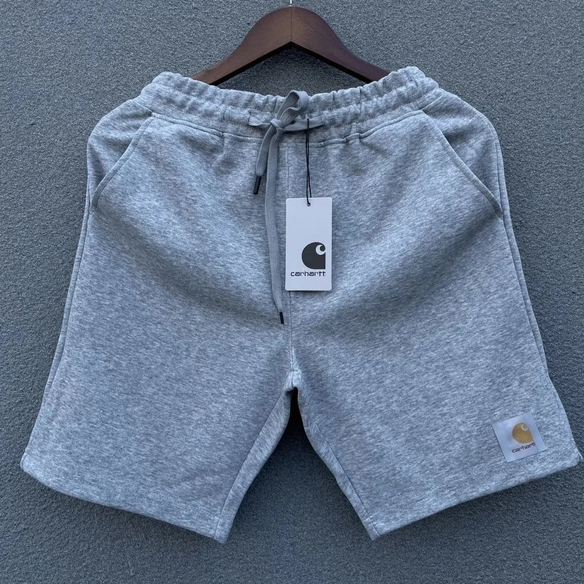 Grey drawstring shorts shown flat on a hanger — Hipobuy Spreadsheet shorts selection