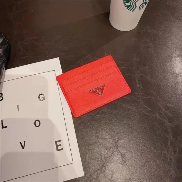 Red card holder shown in the linked Prada catalog listing