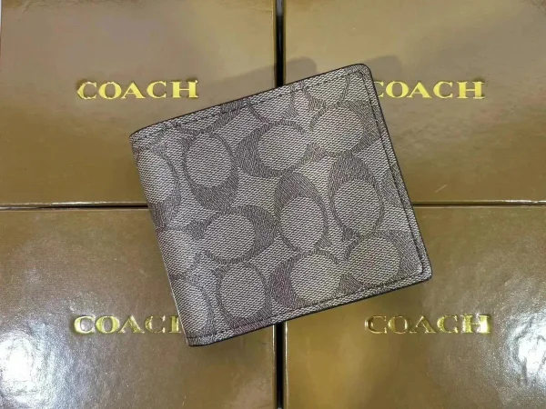 Signature-pattern wallet shown in the linked Coach catalog listing