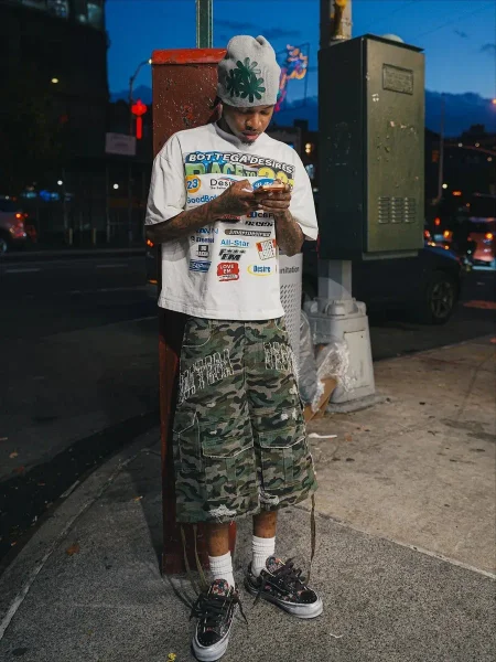 Camo cargo shorts shown in the linked Bottega Veneta catalog listing