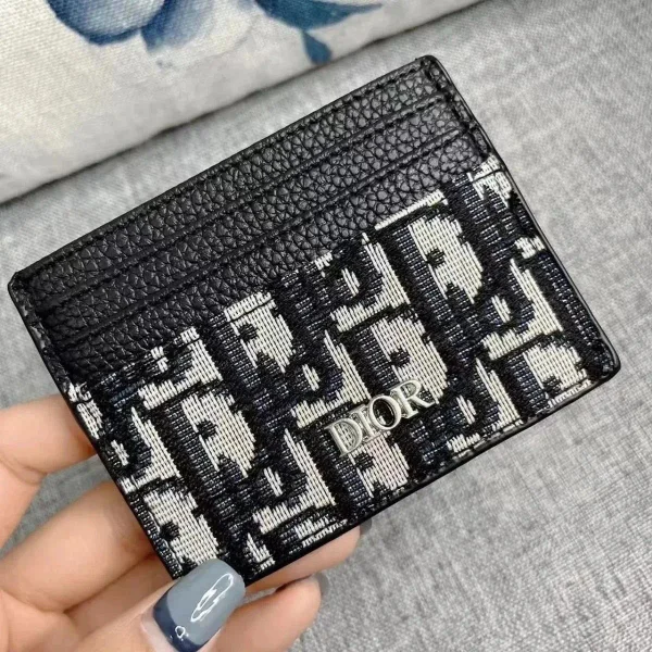 Black monogram card holder shown in the linked Dior catalog listing